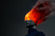© Marcos Osorio/Stocksy - Conceptual representation of a burning head with vivid flames