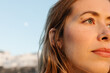 © Adrian Rodd/Stocksy - Close-up portrait of a young woman, posing with a cheerful countenance