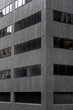 © Sonja Lekovic/Stocksy - Grey modern minimal bulding facade background