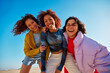 © Javier Díez/Stocksy - Cheerful bright women hugging