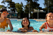 © Stephanie Tamir/Stocksy - Kids playing at the pool