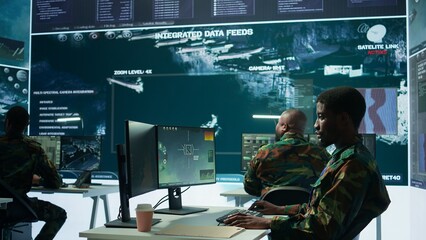 Poster - High tech military office with soldiers analyzing real time data, processing intelligence information and coordinating strategic operations to support army field missions effectively. Camera B.