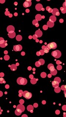 Leinwandbilder - Vertical video with Soft red glowing bokeh light particles scattered on a black background, creating a dreamy atmosphere