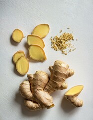 Wall Mural - Fresh ginger root, sliced and ground, ready for use.  A healthy and flavorful spice.