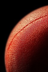 Fototapete - Close-up of a red textured sphere with a seam.