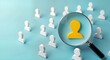 © Pete - Yellow human icon highlighted by magnifying glass among white icons. Focus on finding suitable person for CRM. Business concept for hiring perfect employee finding ideal client. Illustration shows