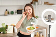 © Pixel-Shot - Female blogger with healthy food recording video in kitchen. Keto diet concept