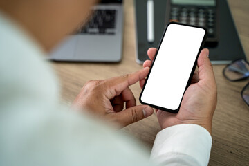 Poster - Close-up man hand mock up using phone blank screen background is blurred in office in communication