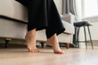 © Mihail - Barefoot walking on warm wooden flooring provides comfort and relaxation in a cozy interior space during a peaceful day