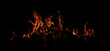© Korneliia - Fire sparks background. Abstract blaze flames background. Burning fire. Texture of fire on a black background. Fire flame with copy space for advertising.