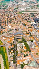 Wall Mural - Vertical video. Parma, Italy. The historical center of Parma. Railway station - Parma. Panorama of the city from the air. Summer day, Aerial View. Rich colors