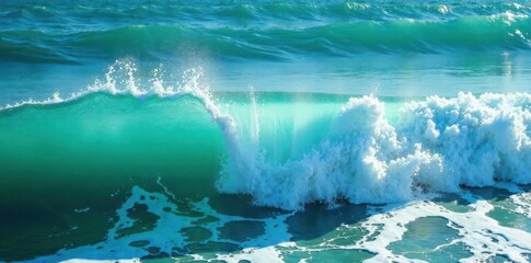 Shimmering blue-green ocean; frothy whitecaps roll in , vibrant, crashing, detail