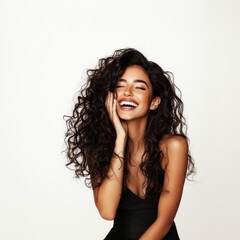 Wall Mural - Smiling woman with long curly hair portrait photography laughing.