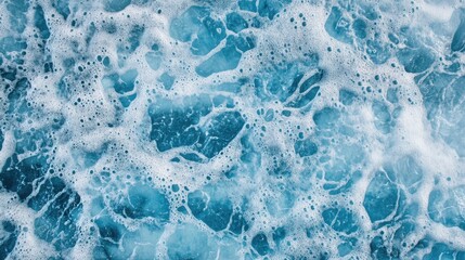 Poster - close up of shimmering blue sea surface with bubbles creating beautiful texture and patterns in the 