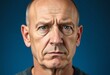 © iushakovsky - Serious, concerned bald man's portrait with worried expression