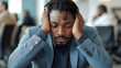 © Siasart - Stressed Businessman Holds Head in Hands Feeling Anxious in Office Environment Quietly