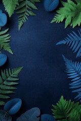 Wall Mural - Green fern leaves bordering dark blue background creating copy space