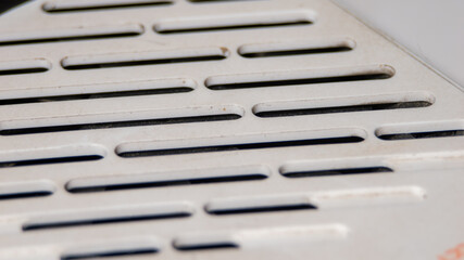 Aufkleber - A close up of a white grill with black stripes