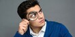 © MarufaEasmin - man looking through magnifying glass searching or investigating something. unemployment finding job search for resume register job interview, find your career