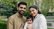 © gn8 - Happy south asian family with baby in park setting for family connections and bonding concepts