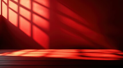 Poster - Vibrant Red Wall Illuminated by Soft Natural Light Creating a Warm Inviting Atmosphere in a Minimalistic Interior Space