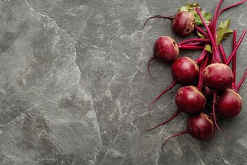 Wall Mural - Bunch of beets on gray stone surface Empty space above Overhead view