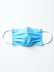 Poster - A Blue Medical Face Mask Is Isolated Against A White Background In A Flat Lay Composition With Clipping Path Available. 00002