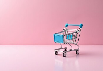 Wall Mural - Mini shopping cart on pink background