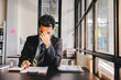 © Suphakant - A young businessman who is stressed out at work is having problems.