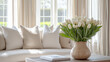 © Irina - Elegant spring home décor with a vase of white tulips and plush seating in bright, airy living room copy space