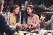 © Kritdanai - Night Out with Friends: A group of friends enjoy a lively evening, sharing laughter and conversation over drinks in a cozy outdoor setting. This image captures the essence of friendship, camaraderie.