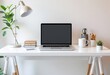 © crispy - Modern home office desk with laptop, lamp, and plants. Minimalist workspace setup for remote work. Clean white interior design for productivity and focus