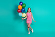 © deagreez - Full body photo of attractive teen woman hold air balloons dressed stylish checkered pink clothes isolated on cyan color background