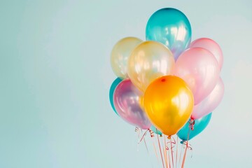 Poster - Colorful balloons floating on a light blue background, suggesting a festive and joyful atmosphere