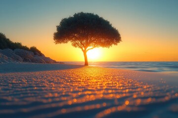 Aufkleber - A single tree stands alone on a beach at sunset