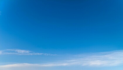 vast blue sky with wispy clouds.