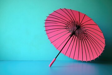 Poster - A pink umbrella sits on a blue floor, perfect for decoration or as a prop in a photo shoot