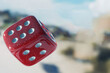 © Vitalii Shkurko - Three vibrant red casino dice caught mid-roll, illustrating the thrill of chance and the anticipation of winning in a gambling scenario. Perfectly designed and clean for a striking view