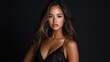 © Babb - A woman in a black dress with long hair and a large bust