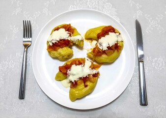 Wall Mural - Classic Ukrainian food, perohê or veréneki stuffed with potatoes and cottage cheese and cooked, served with different types of sauce and salted and sour cream