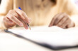 © DC Studio - General manager examining contract terms before signing and giving her CEO authorization, ambitious enterprise leader with full authority. Working on legal paperwork management. Close up.