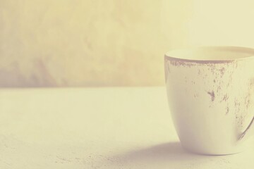 Poster - A single coffee cup sits on a table, ready to be filled with your favorite brew