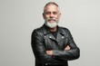 © LimeSky - Confident older man with a beard in a leather jacket facing the camera on a white backdrop