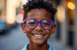 © Krystyna - Dark-skinned happy boy in purple glasses on a blurred background. Boy in optical glasses. Boys with poor eyesight in bright cheerful glasses.