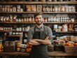 © Bisera - Young entrepreneur managing a local shop, small business owner standing confidently in a retail store setting