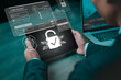 © Kampan - Businessman use a tablet with a fingerprint scanner for secure access, featuring a prominent digital lock icon and cyber security interface. Showcases modern technology for access authentication