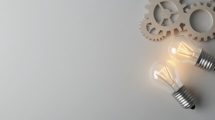 Two glowing light bulbs are placed alongside gears symbolizing creativity and innovation on a subtle gray background