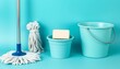 © MdNazim - Fresh Cleaning Essentials: Aqua-Themed Buckets, Mop, and Soap Supplies