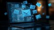 © Atchariya63 - Digital communication with emails floating from a laptop screen at night.
