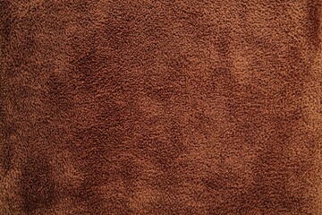 Close-up texture of brown suede fabric.